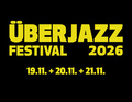 Gelber Text auf schwarzem Hintergrund: 'ÜBERJAZZ FESTIVAL 2026' mit den Daten '19.11. + 20.11. + 21.11.'.