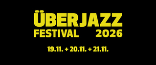 Gelber Text auf schwarzem Hintergrund: 'ÜBERJAZZ Festival 2026' mit den Daten '19.11. + 20.11. + 21.11.'.